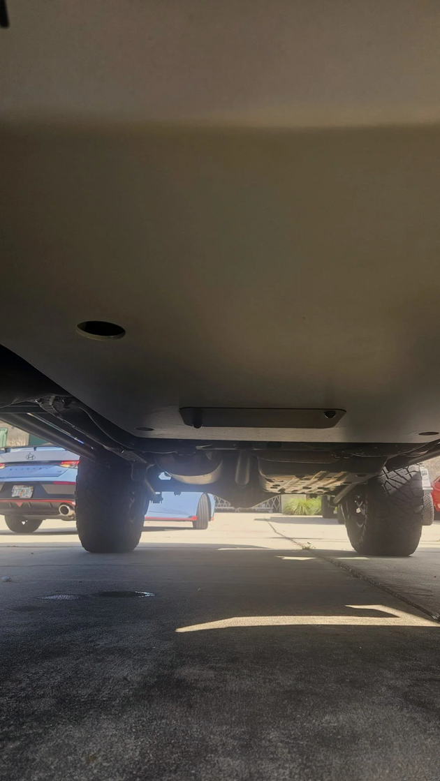 CNC laser-cut off-road skid plate for Toyota 4Runner designed for rock crawling and protecting vital components from trail impacts.