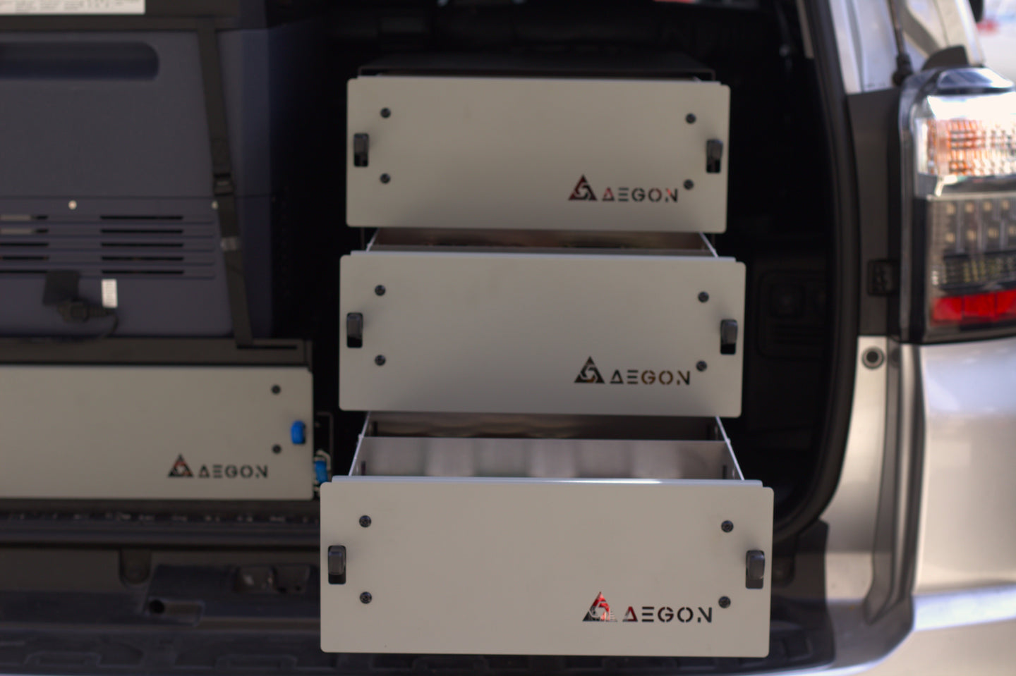 Individual AEGON modular aluminum storage drawer, stackable and expandable for custom overland and work truck builds.