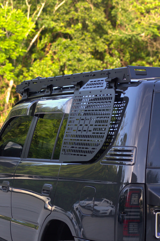 Tactical low-profile aluminum Molle panel for Toyota Prado 2nd Gen, maintaining rear visibility.