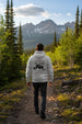 Person wearing the durable Anatomy of an Overland heavy-duty hoodie in grey featuring a detailed technical schematic design by Aegon Ironwork. - BACK
