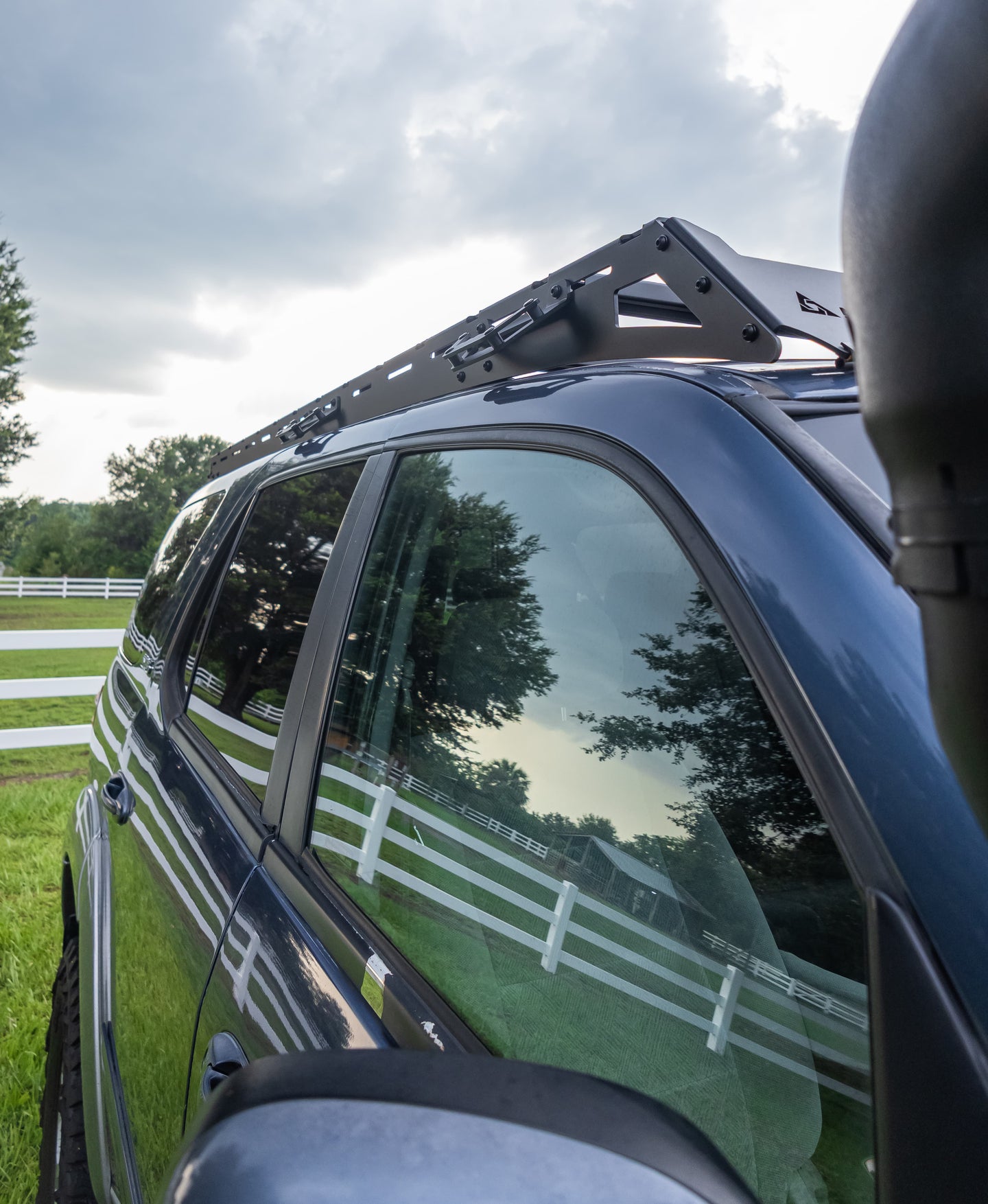 Precision CNC laser-cut steel roof rack for Toyota Sequoia featuring a sleek low-profile design and black powder coat finish.