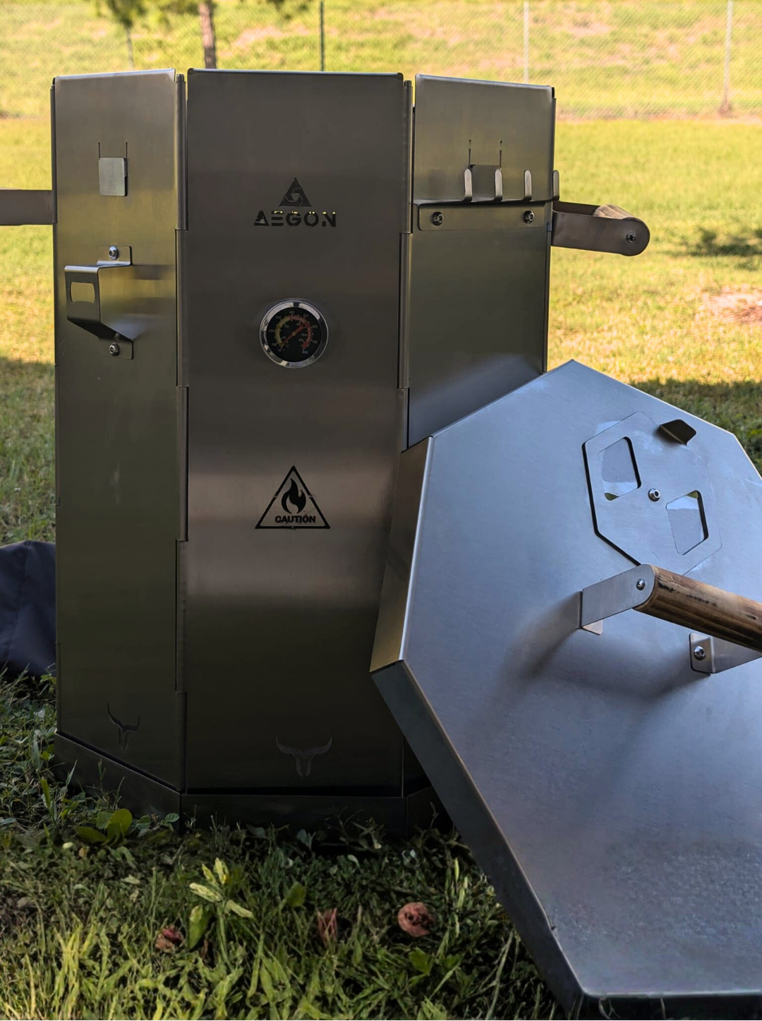 Complete portable smoker system including meat hooks, half grill grate, charcoal chimney, and temperature gauge