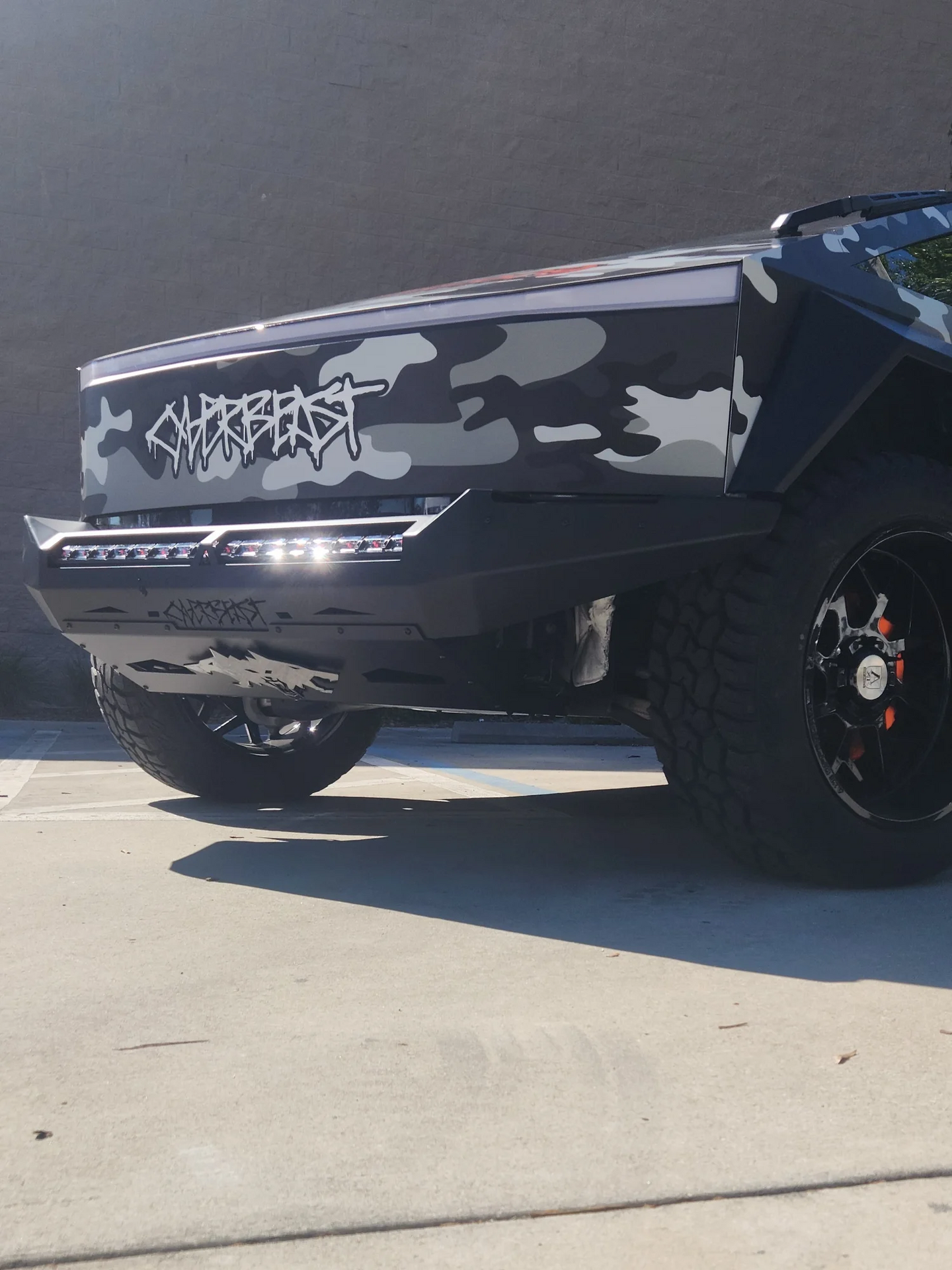 Rugged Cybertruck front bumper featuring an included RGB LED bar and custom lighting compatibility.