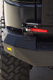 AEGON FJ Cruiser rear bumper showing the swing-out latch mechanism and amber marker light
