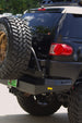 Side view of the Toyota FJ Cruiser rear end with AEGON bumper and mounted spare tire carrier