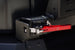 Close-up of the red anodized quick-release latch on the AEGON FJ Cruiser swing-out rear bumper