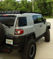 Complete FJ Cruiser roof rack kit including 2 side rails, 5 crossbars, and 2 wind deflectors for cargo management.