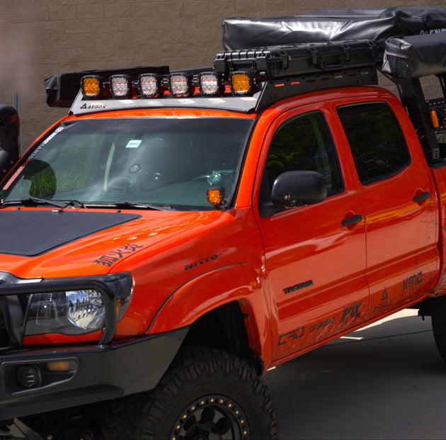 Ultra-lightweight 28 lb aluminum roof rack for Tacoma featuring a durable black powder coat finish and CNC laser-cut construction.