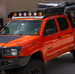Ultra-lightweight 28 lb aluminum roof rack for Tacoma featuring a durable black powder coat finish and CNC laser-cut construction.
