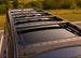 Sleek low-profile roof rack for Lexus GX 460 featuring a front wind deflector to reduce noise and improve fuel efficiency.