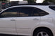 Sleek low-profile aluminum roof rack for Lexus RX 350 with wind deflectors to reduce noise and maintain fuel efficiency.