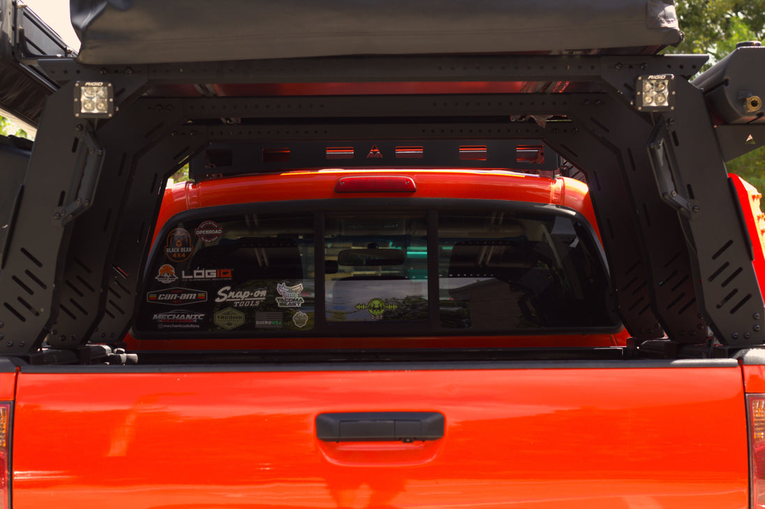 Low-profile overlanding bed rack system designed to sit below the cab for better aerodynamics.