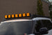 Sleek low-profile Toyota Sequoia roof rack with integrated front mounts for off-road LED light bars.