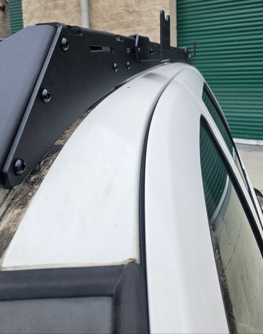 Sleek low-profile tactical roof rack for Jeep WJ designed to reduce wind resistance and improve fuel efficiency.
