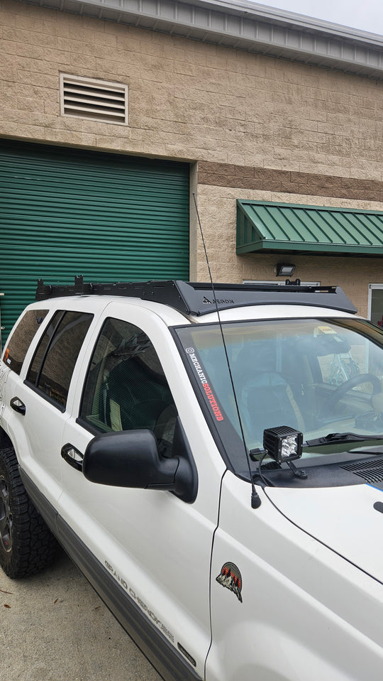 Precision CNC laser-cut steel roof rack made in the USA for the Jeep Grand Cherokee WJ platform.