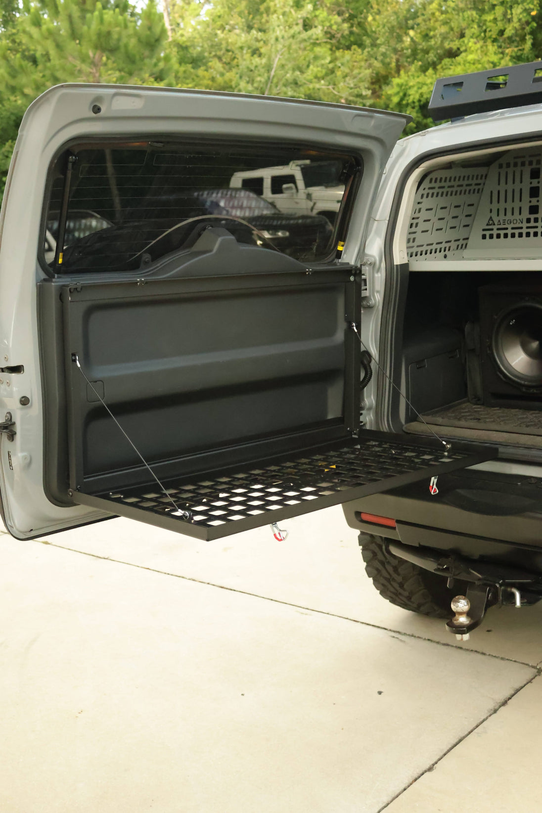 Precision-engineered tactical tailgate table made in the USA for FJ Cruiser, featuring a sleek low-profile design and included hardware.