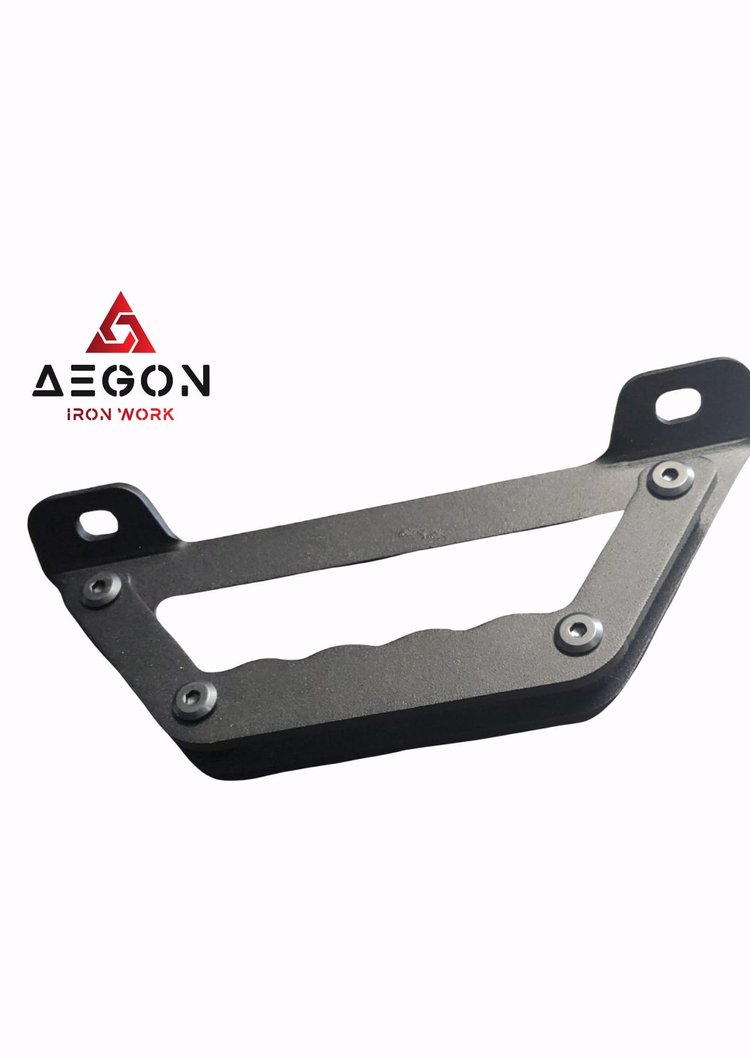 asy bolt-on utility handle for Aegon racks featuring an ergonomic grip and low-profile design for trail gear stabilization.