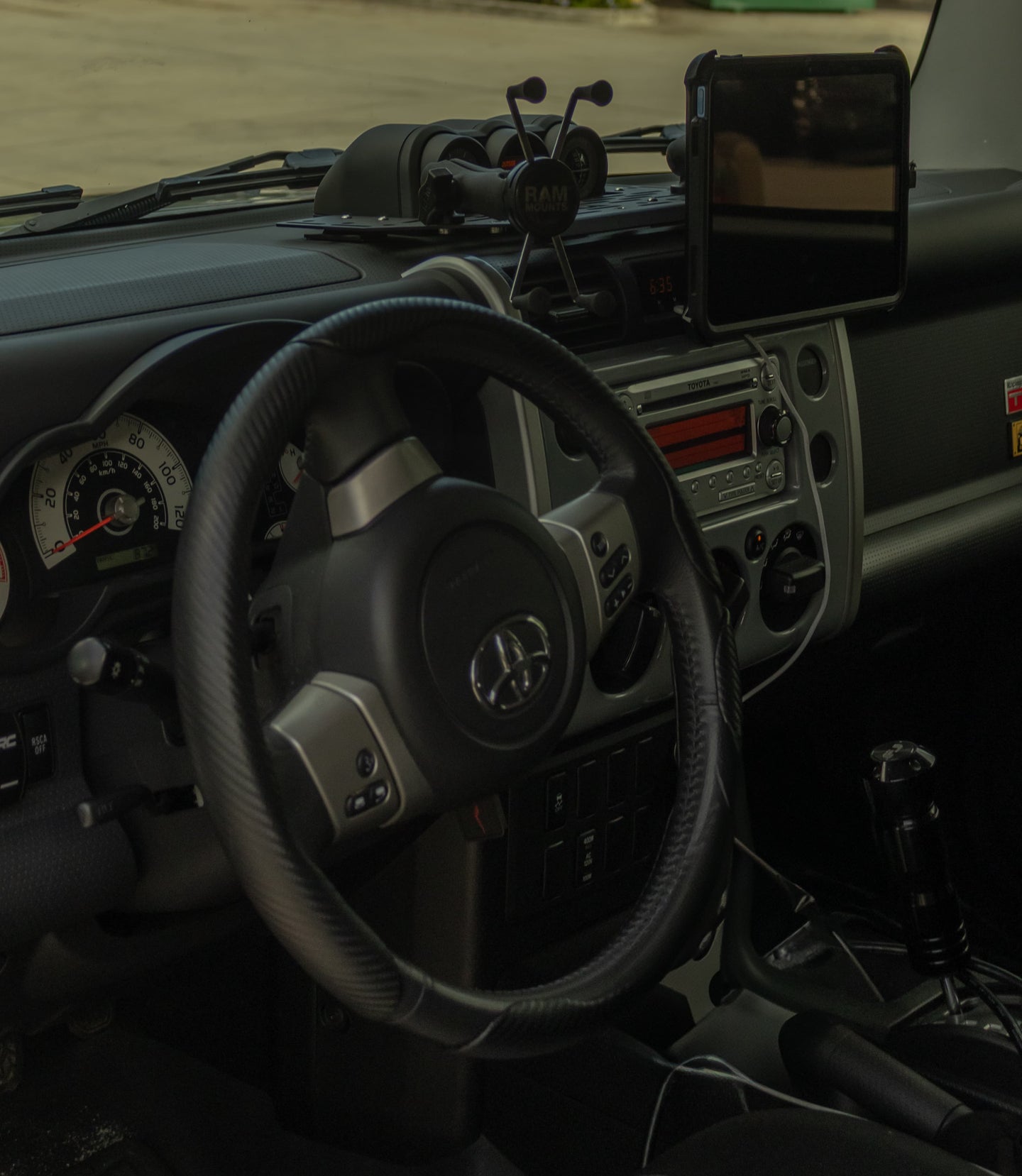 Precision-cut aluminum dashboard storage panel for FJ Cruiser featuring easy no-drill installation and a sleek low-profile design.