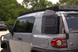 Lightweight 7lb aluminum interior Molle rack for FJ Cruiser featuring a no-drill installation and black powder coat finish.