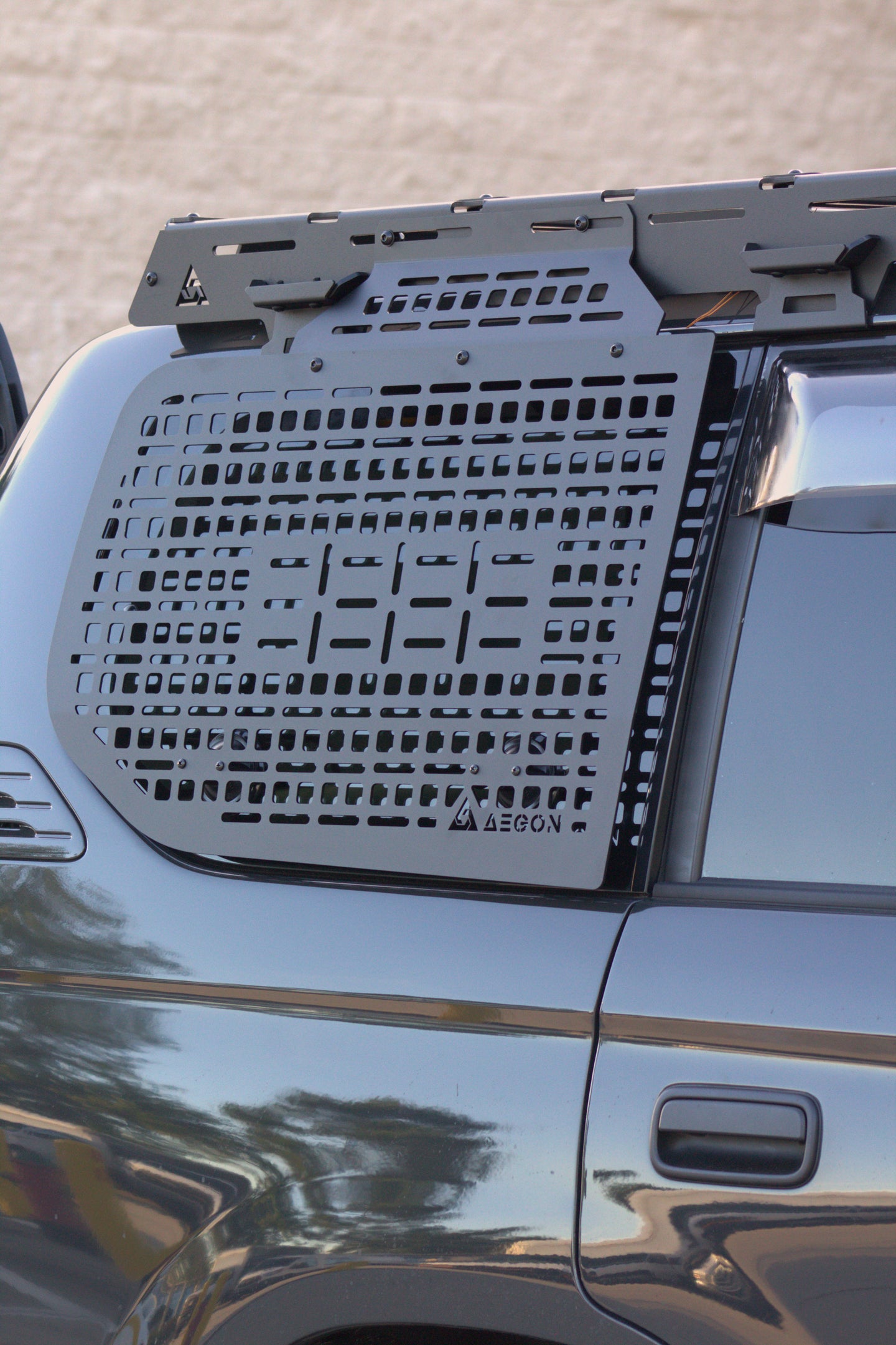 Rear window storage panel for 1996-2002 Toyota Prado showing the easy no-drill mounting hardware.