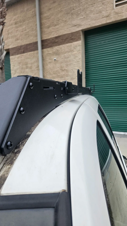 Precision-engineered heavy-duty steel bracket for secure canopy mounting during off-road and trail driving.