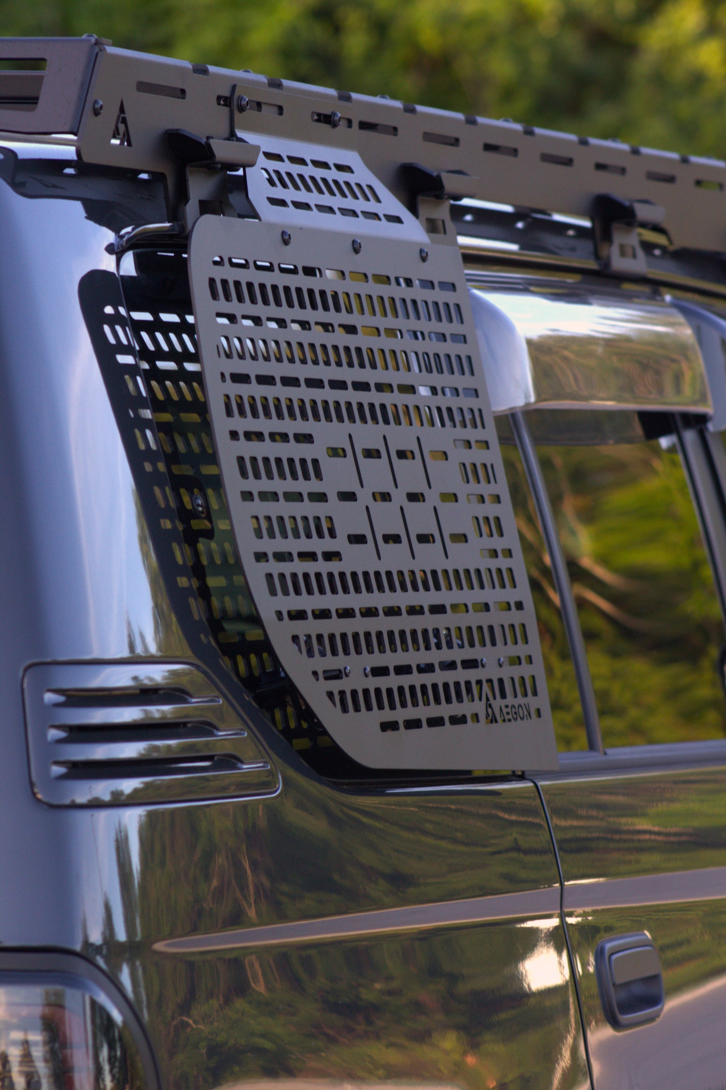 Toyota Prado 90 Series interior storage rack organized with pouches and emergency tools on a Molle panel.