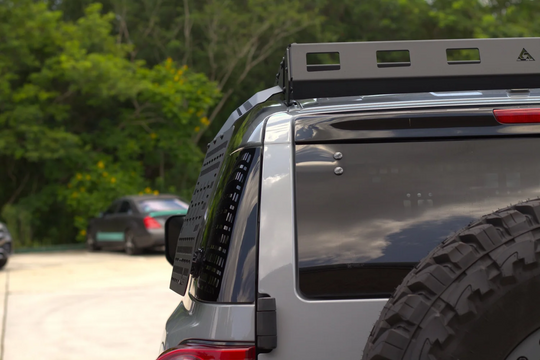 Close-up of the rear deflector fitment on an AEGON steel roof rack for a finished professional look.