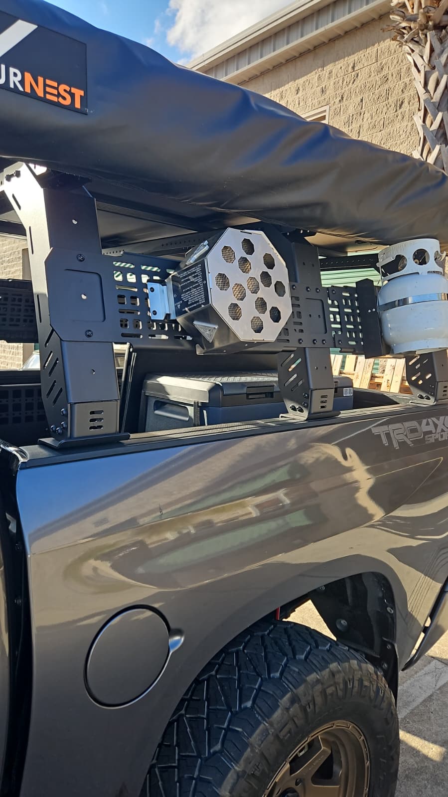 Streamlined campfire storage solution showing the bracket mounted without a carry bag.