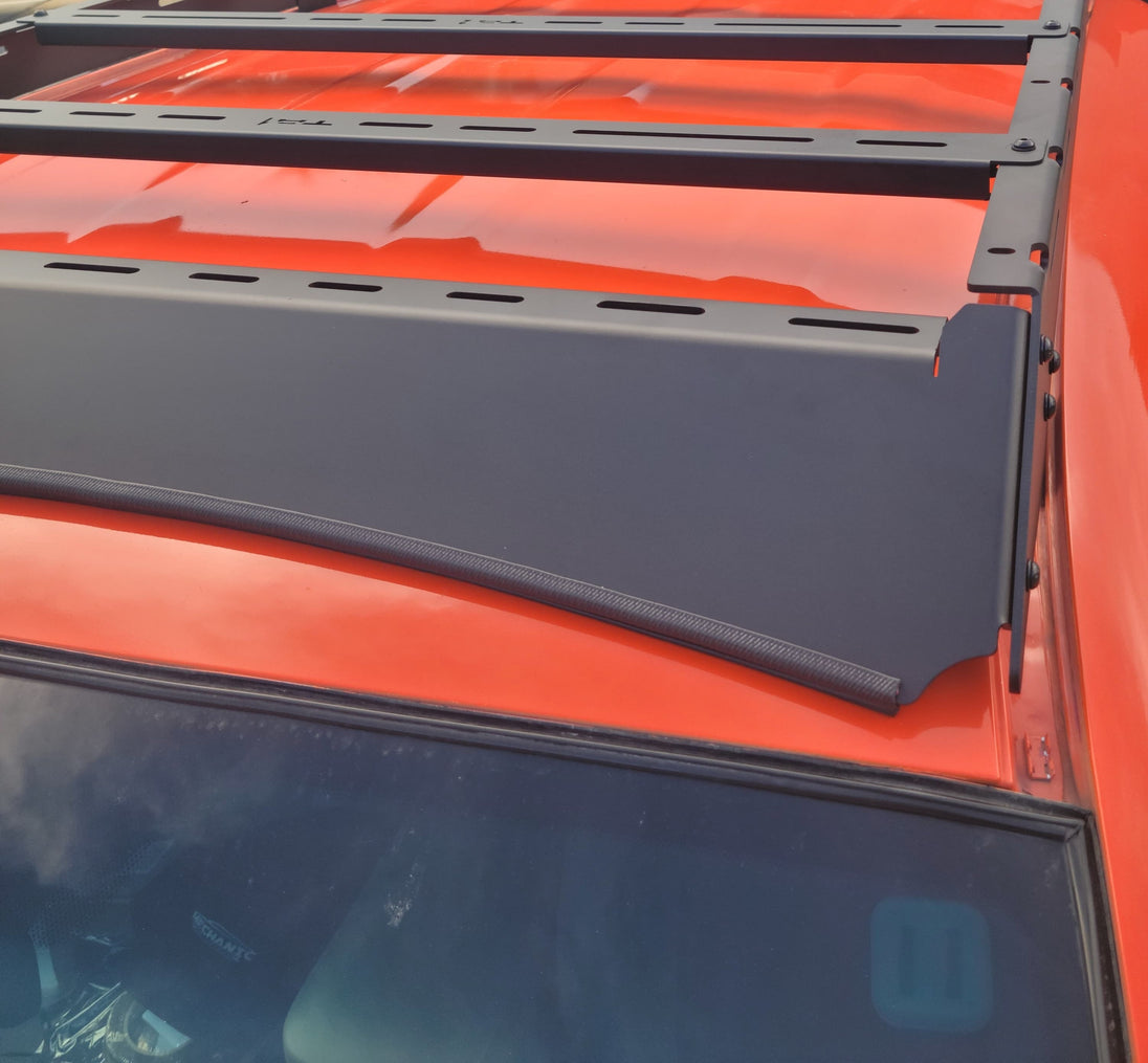 Precision-engineered Tacoma roof rack featuring integrated front light mounts for off-road LED bars and accessories.