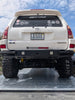 Rear view of a 4th Gen Toyota 4Runner with a black high-clearance steel bumper.