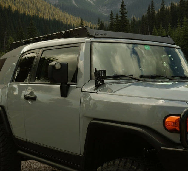 Heavy-duty aluminum roof rack for Toyota FJ Cruiser with 600 lbs dynamic and 900 lbs static load capacity.