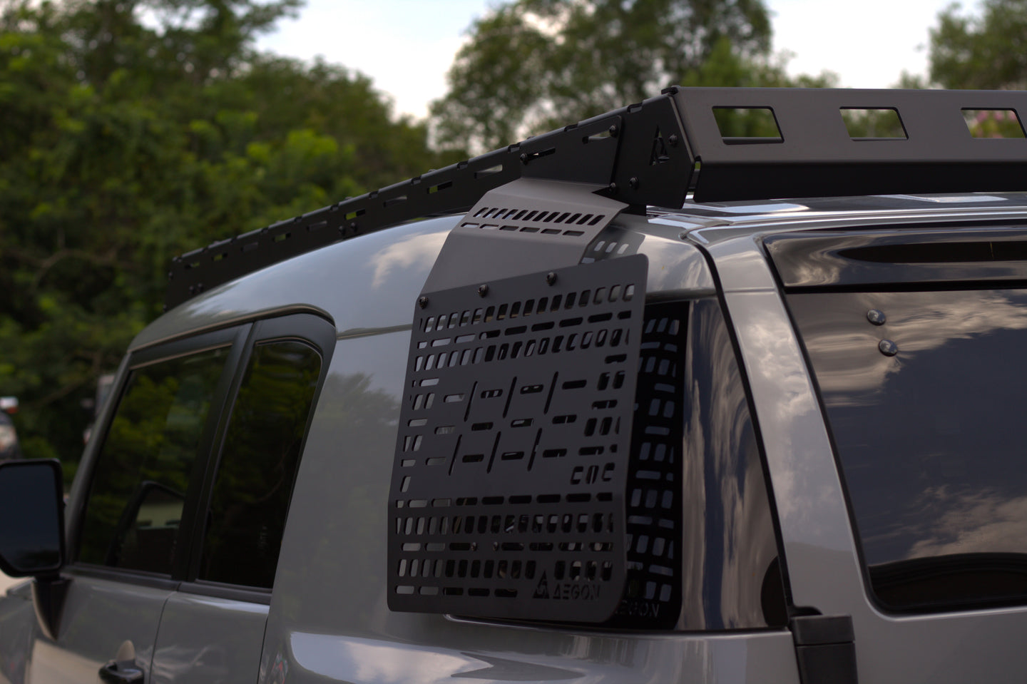 Precision-engineered black steel Molle panel for Toyota FJ Cruiser rear window storage with 1500lb static load capacity.