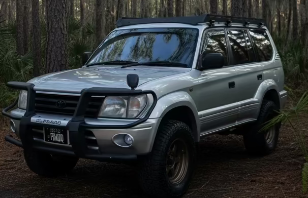 Heavy-duty steel roof rack designed for Toyota Prado 90 and 95 series models from 1996 to 2002.