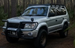 Heavy-duty steel roof rack designed for Toyota Prado 90 and 95 series models from 1996 to 2002.
