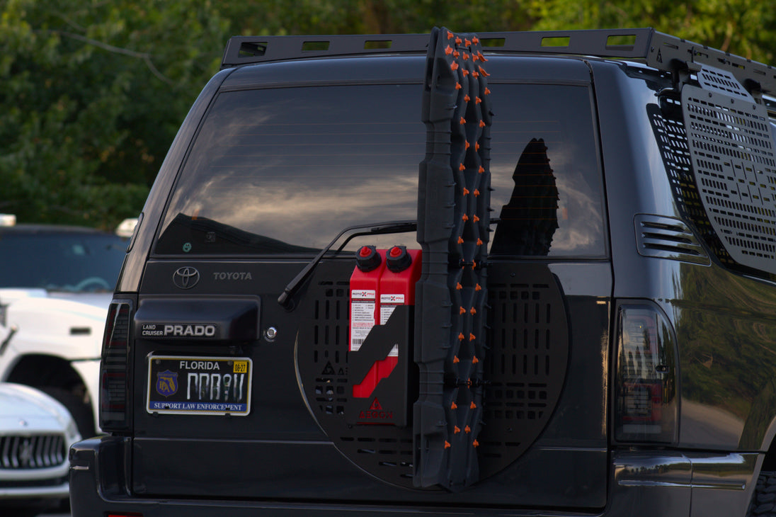 Toyota Prado 90 Series equipped with Aegon Ironwork rear door Molle panel for off-road expedition gear organization.