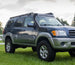 Full-length heavy-duty steel roof rack custom-fit for 1st Generation Toyota Sequoia models from 2001 to 2007.