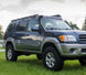 Full-length heavy-duty steel roof rack custom-fit for 1st Generation Toyota Sequoia models from 2001 to 2007.