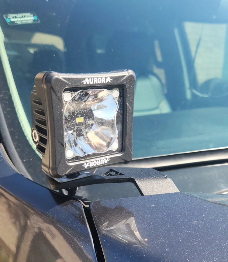 Pair of black aluminum ditch light brackets designed for Toyota Tundra models from 2007 to 2021.