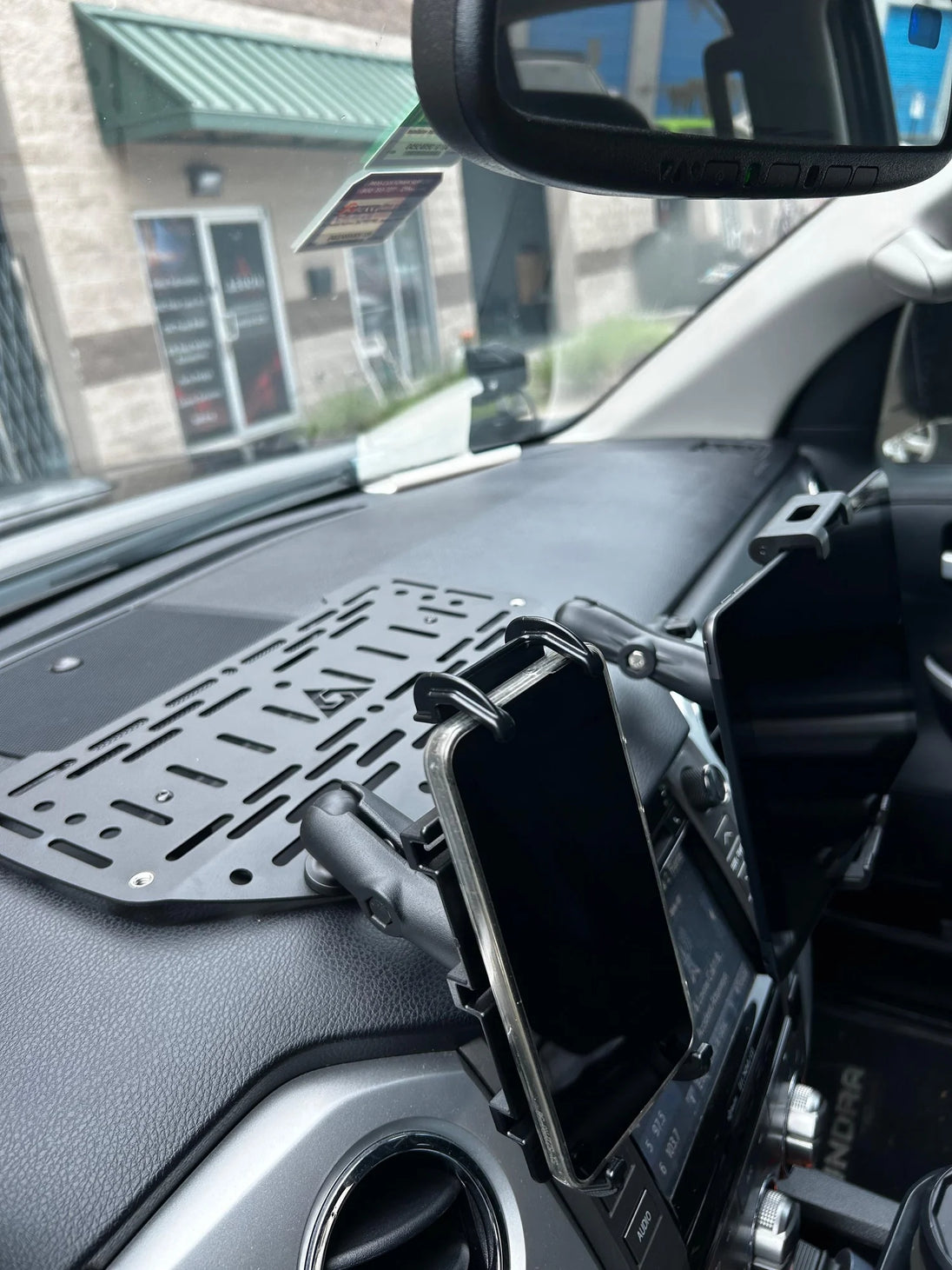 Aluminum interior dashboard Molle panel for Toyota Tundra (2007-2021) designed for mounting devices and gear.