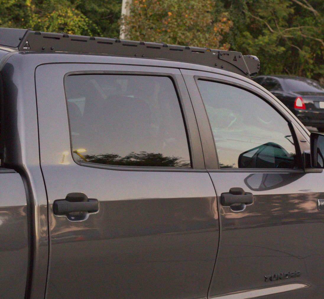 Black powder-coated overland roof rack for Toyota Tundra CrewMax, built for tough trail conditions.