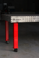 Heavy duty welding workstation with 4 inch leveling casters supporting up to 4400 lbs load.